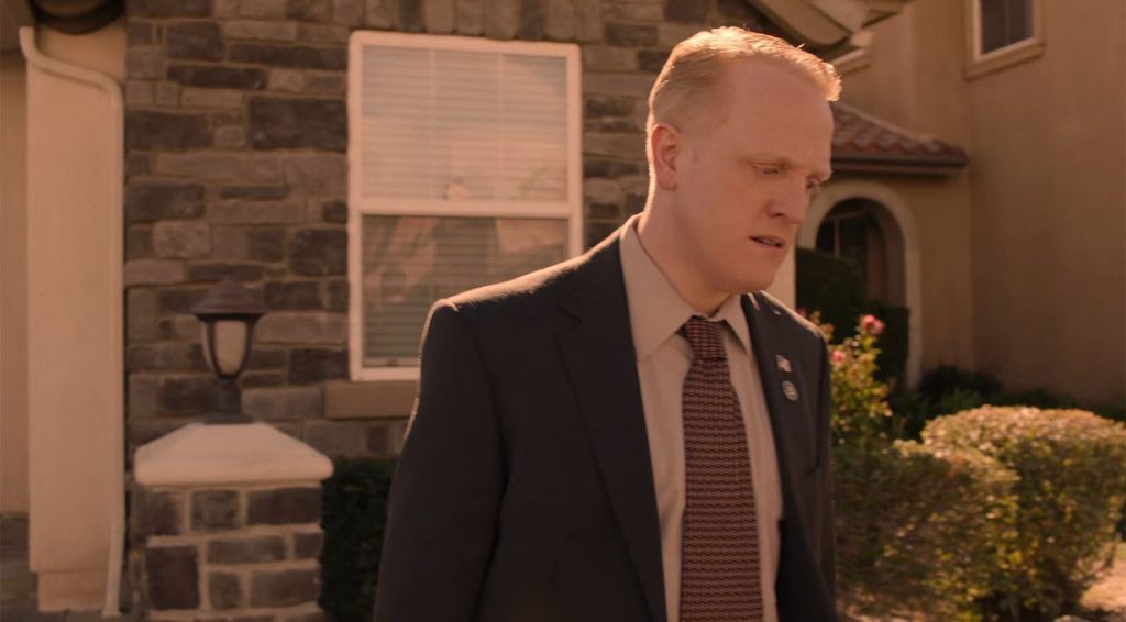 Agent Wilson outside the Jones' home