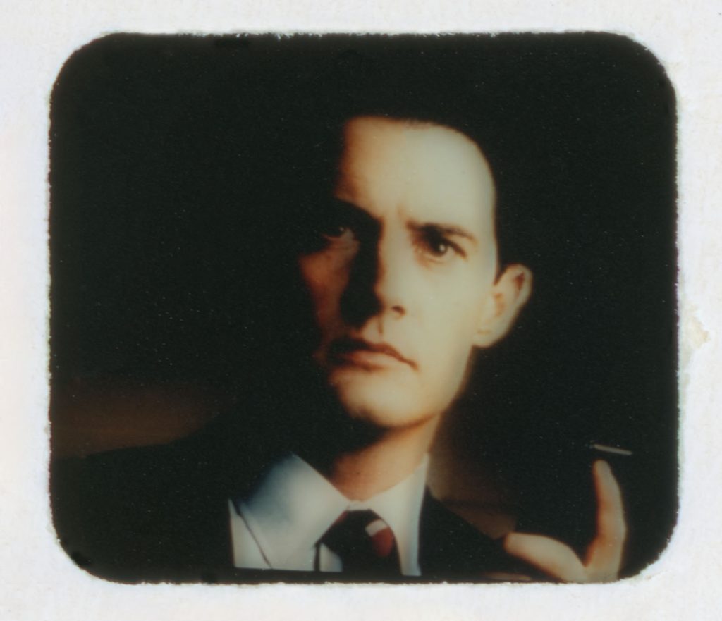 Special Agent Dale Cooper holding a tape recorder