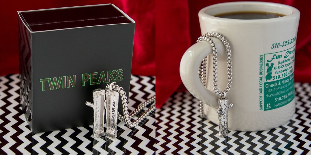 Silver log as the Log Lady Locket by a box and coffee mug