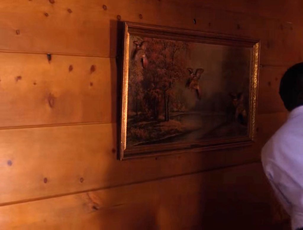 Artwork hanging on a wooden wall