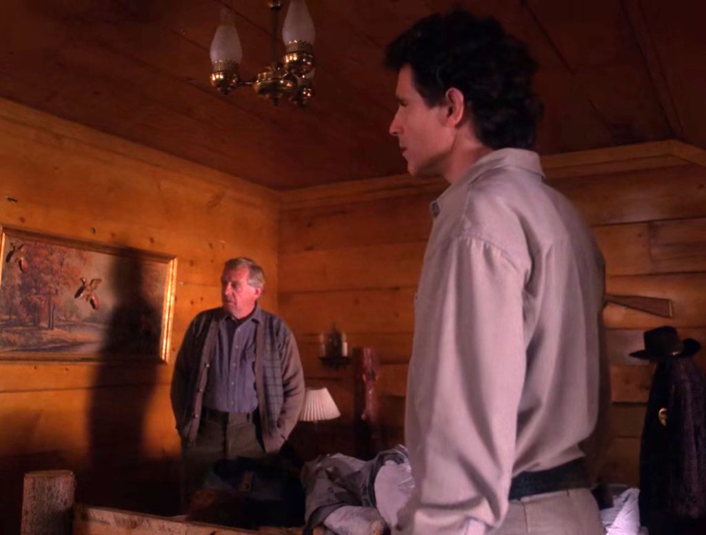 Doc Hayward and Sheriff Truman standing in Cooper's room
