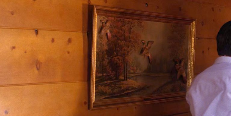 Artwork hanging on a wooden wall