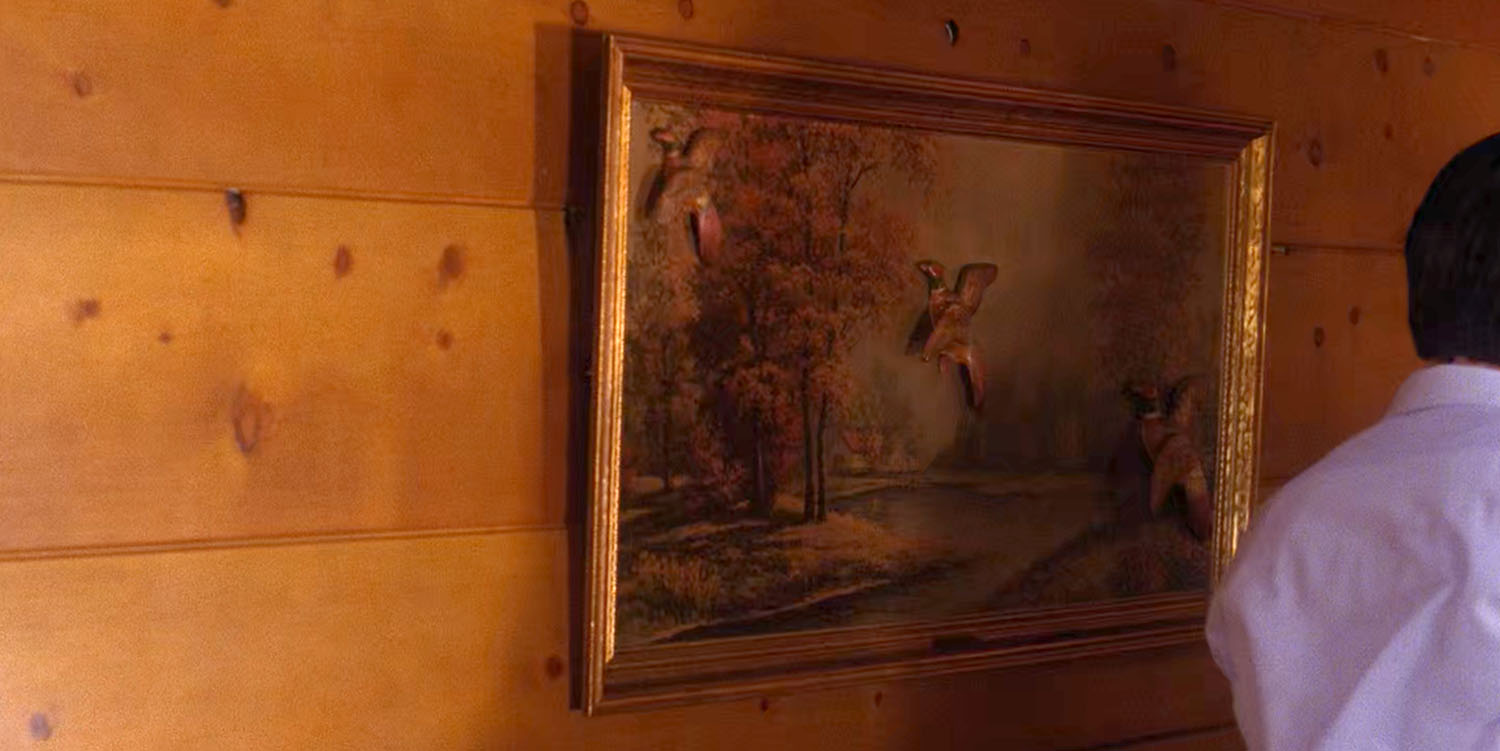 Artwork hanging on a wooden wall