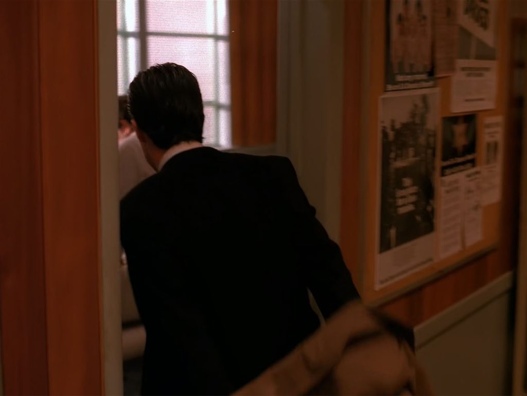 Special Agent Dale Cooper entering the conference room