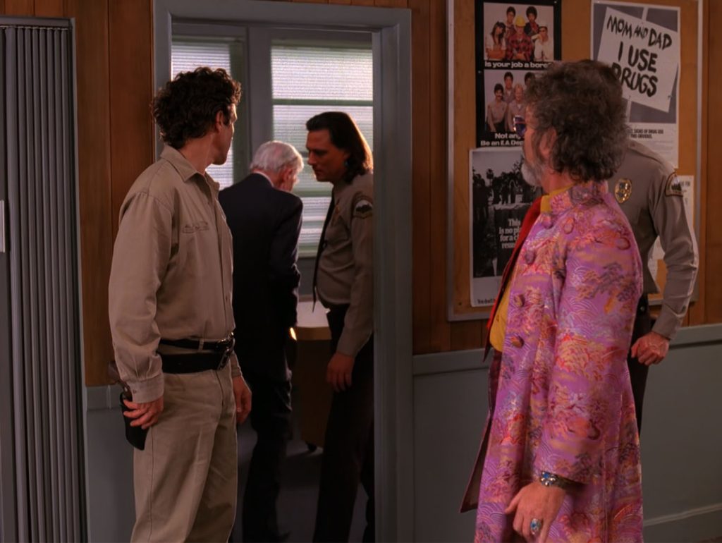 People entering the conference room