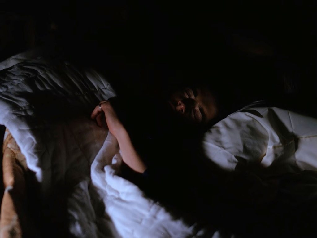 Special Agent Dale Cooper sleeping in his bed.