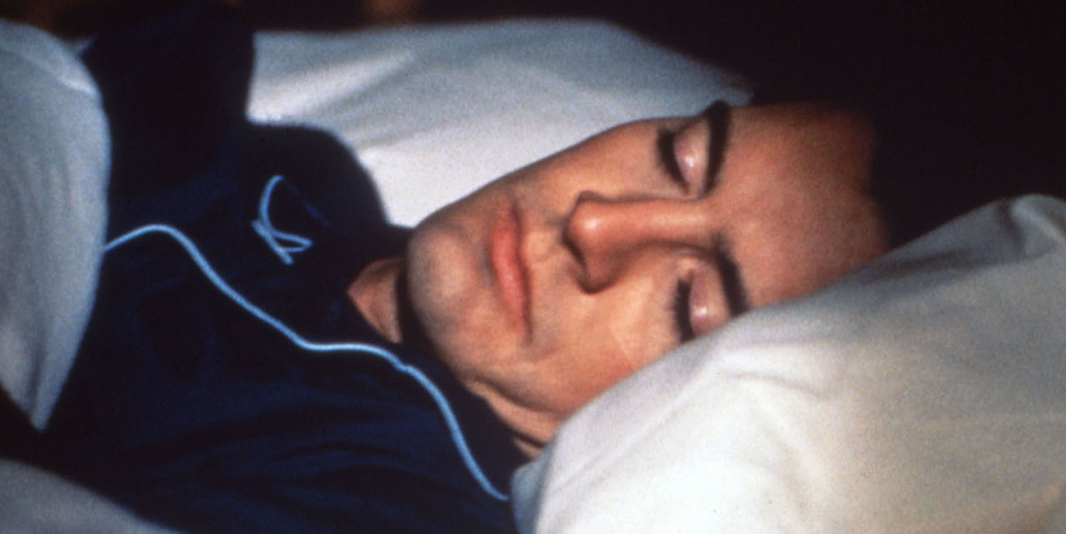 Special Agent Dale Cooper sleeping in his bed.