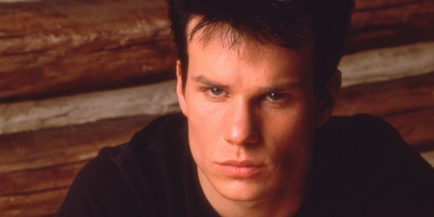 James Marshall as James Hurley sitting at a table with the other half of Laura Palmer's half-heart necklace