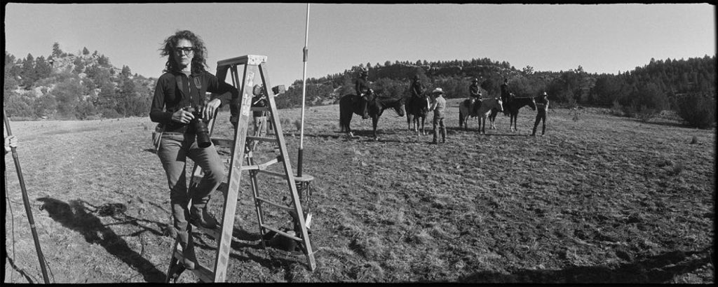 Lorey Sebastian on a ladder in a field