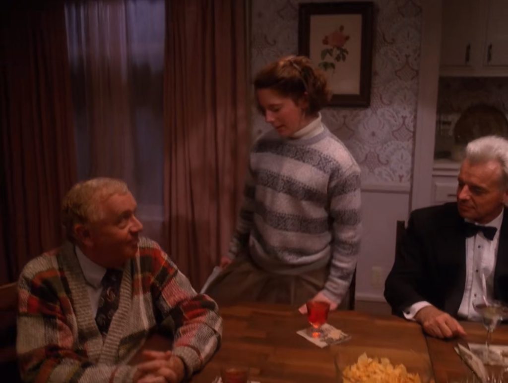 Harriett Hayward stands up at the dining table