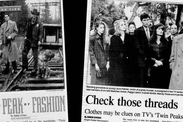 Newspaper articles against a black background