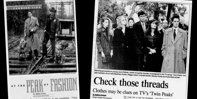 Newspaper articles against a black background