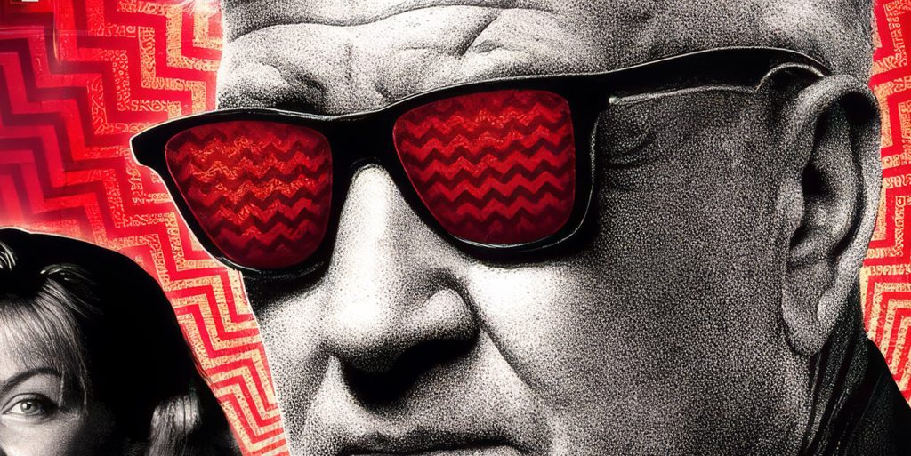 David Lynch wearing glassed with chevron pattern in reflection