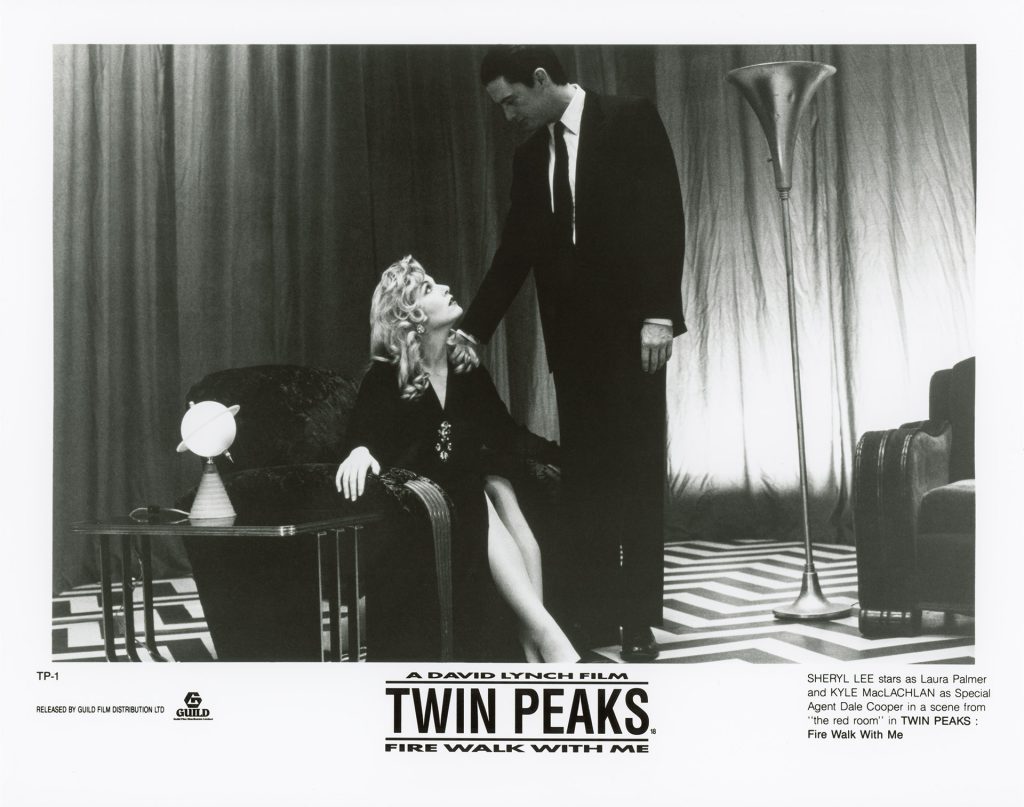 SHERYL LEE stars as Laura Palmer and KYLE MacLACHLAN as Special Agent Dale Cooper in a scene from "the red room" in TWIN PEAKS : Fire Walk With Me