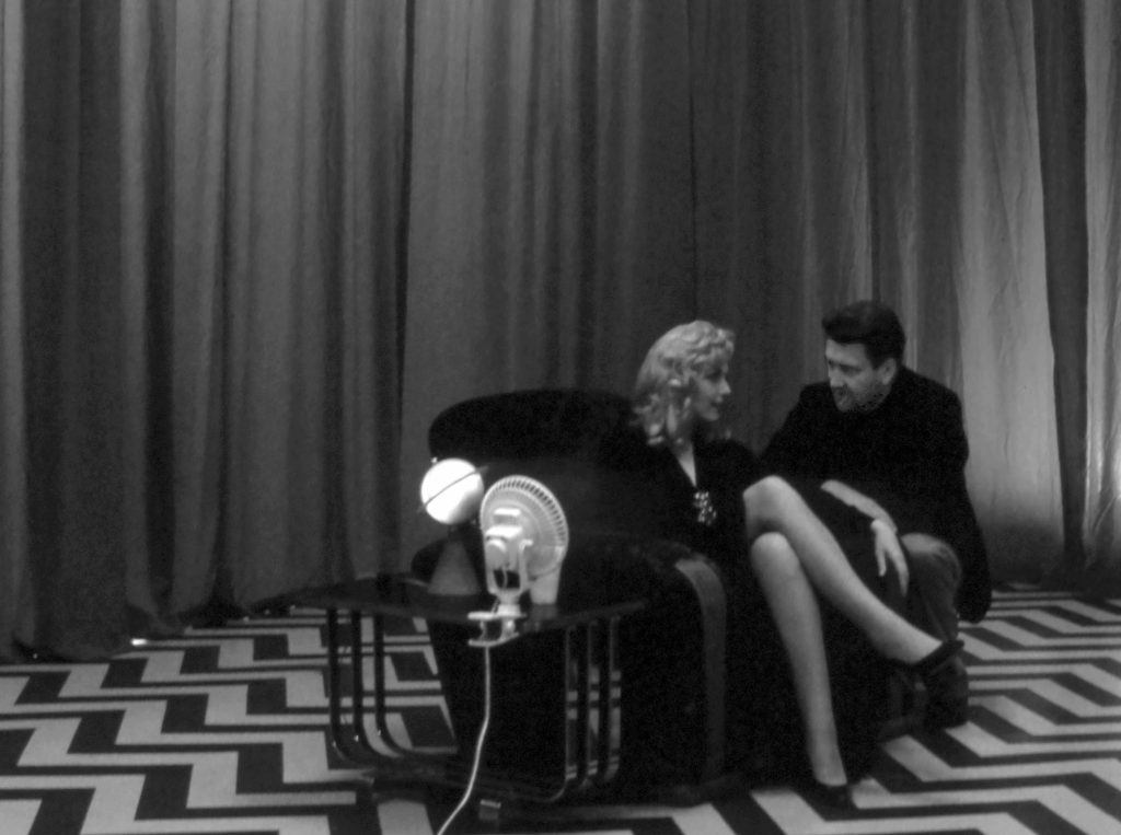 David Lynch speaking with Laura Palmer on the set of the Red Room