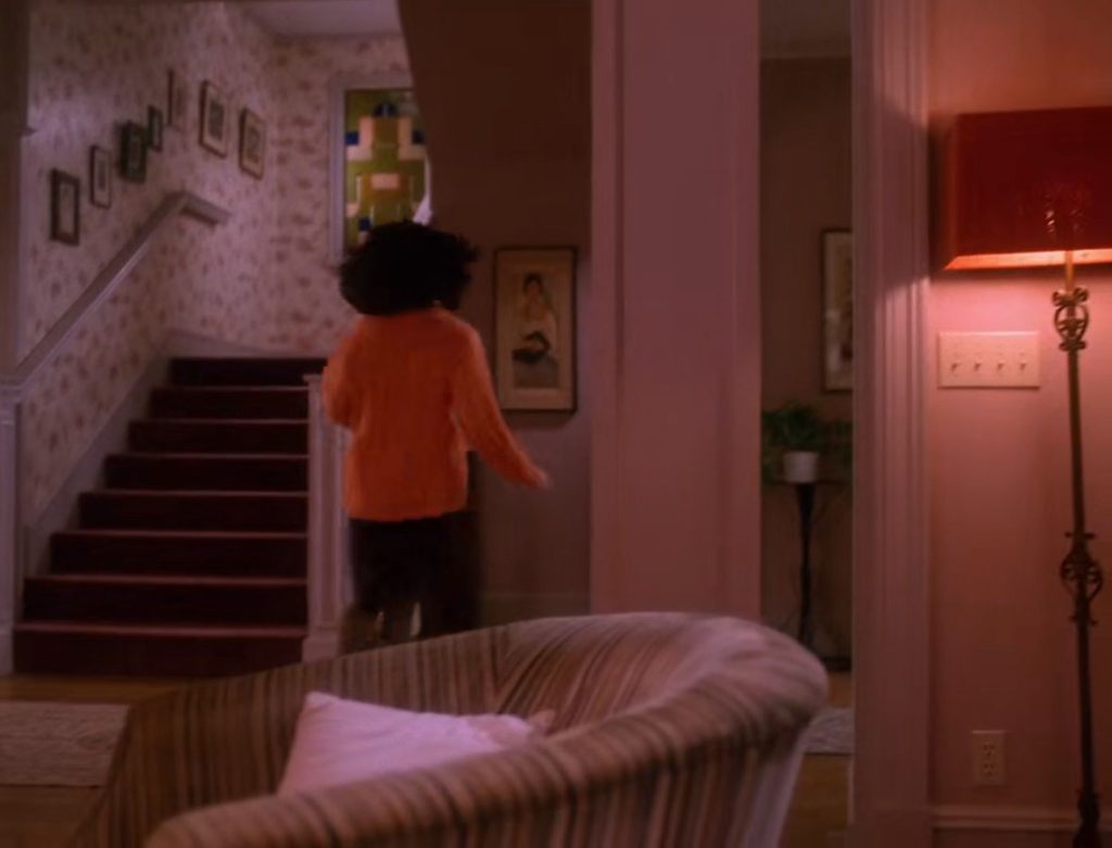 Donna Hayward running to the phone
