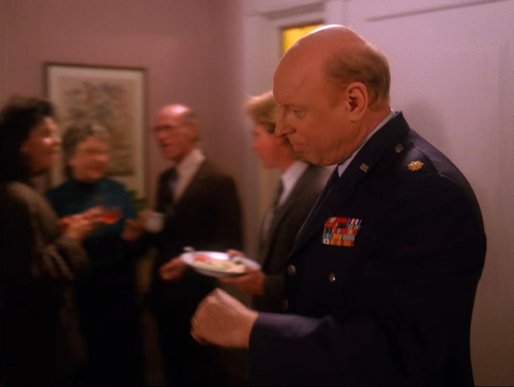 Major Briggs entering the house