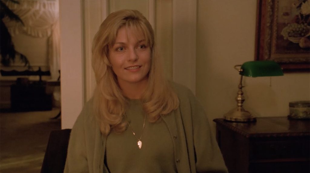 Laura Palmer sitting in her dining room