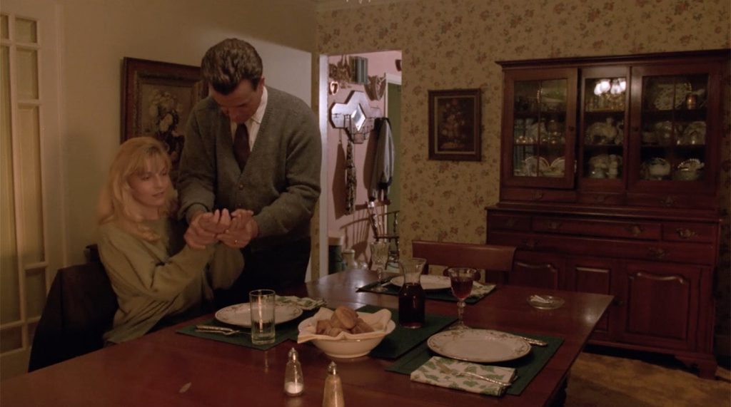Leland checking the cleanliness of Laura's hands
