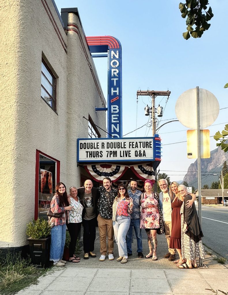 Group of people standing outside the North Bend Theatre