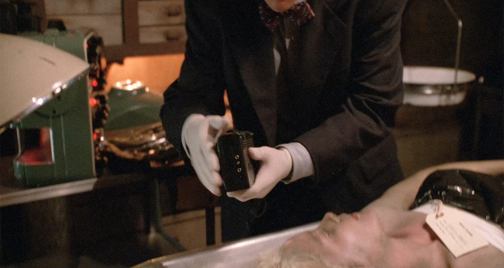 Agent Sam Stanley holding the tape recorder
