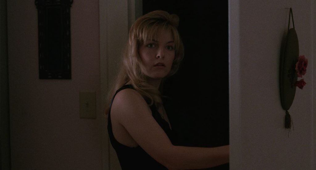 Laura Palmer standing at the doorway from Twin Peaks: Fire Walk With Me
