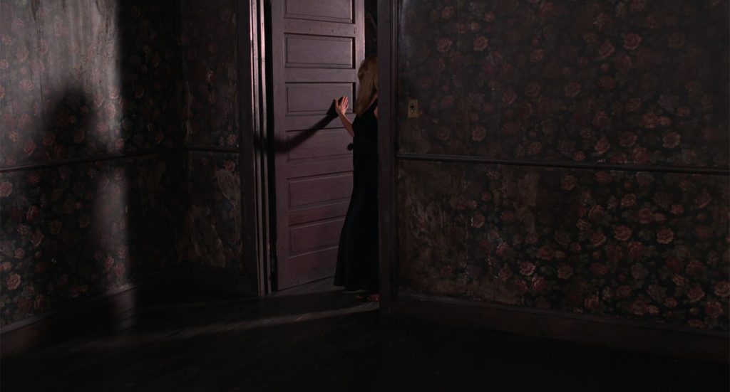 Laura Palmer standing at the doorway from Twin Peaks: Fire Walk With Me