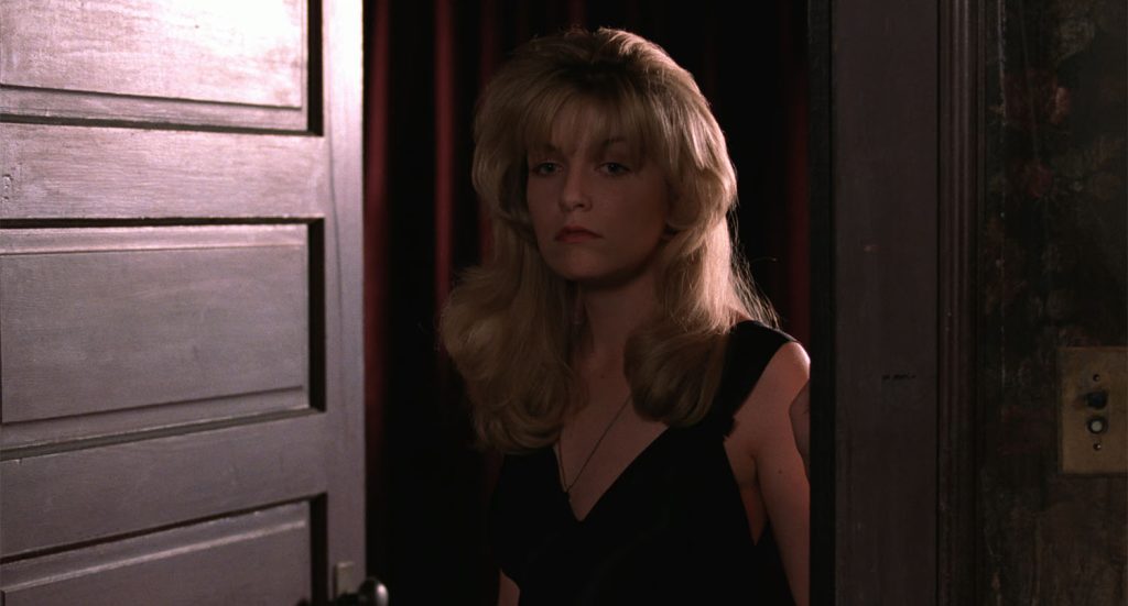 Close up of Laura Palmer standing at the doorway from Twin Peaks: Fire Walk With Me