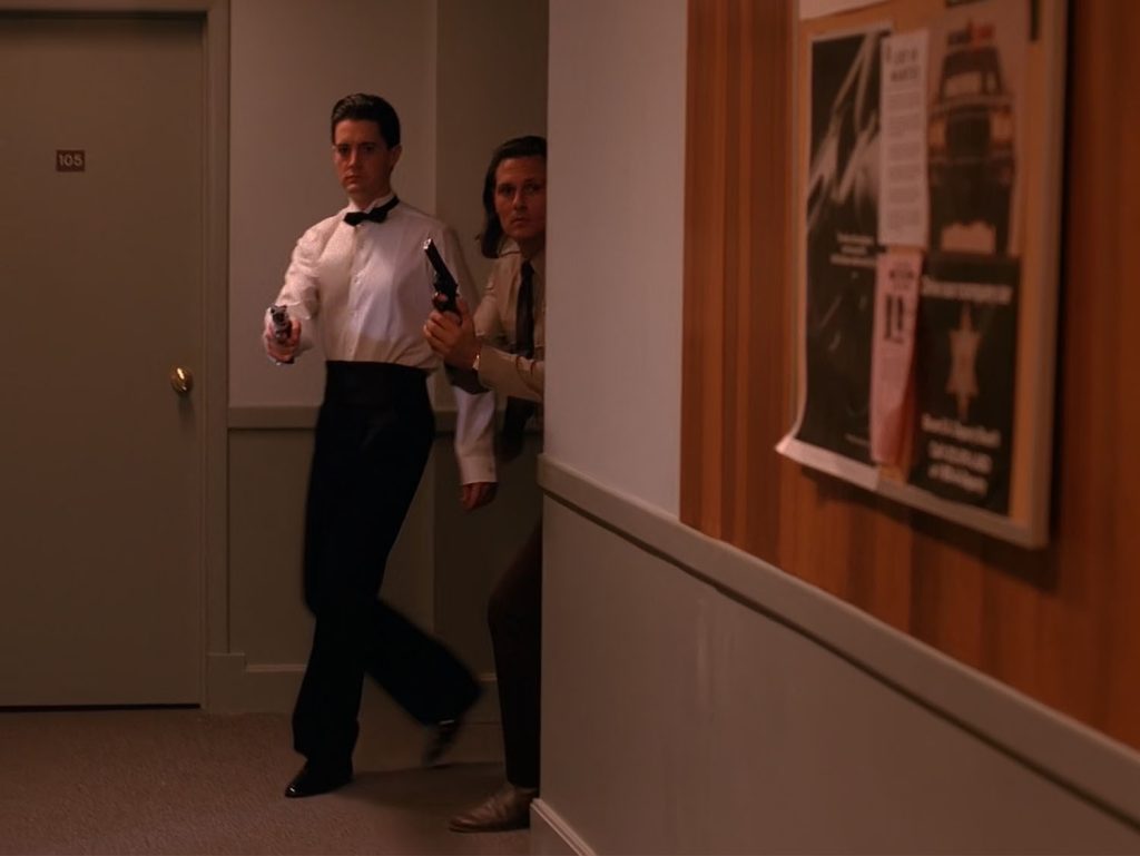 Agent Cooper in the hallway with Deputy Hawk