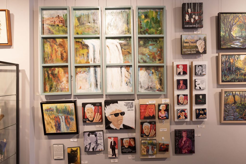Wall of framed artwork