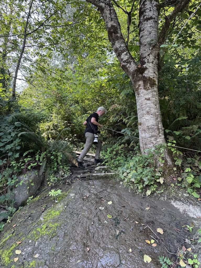 Steven climbing down rocks