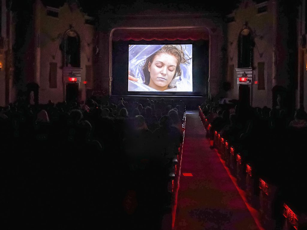 Laura Palmer wrapped in plastic on a movie screen
