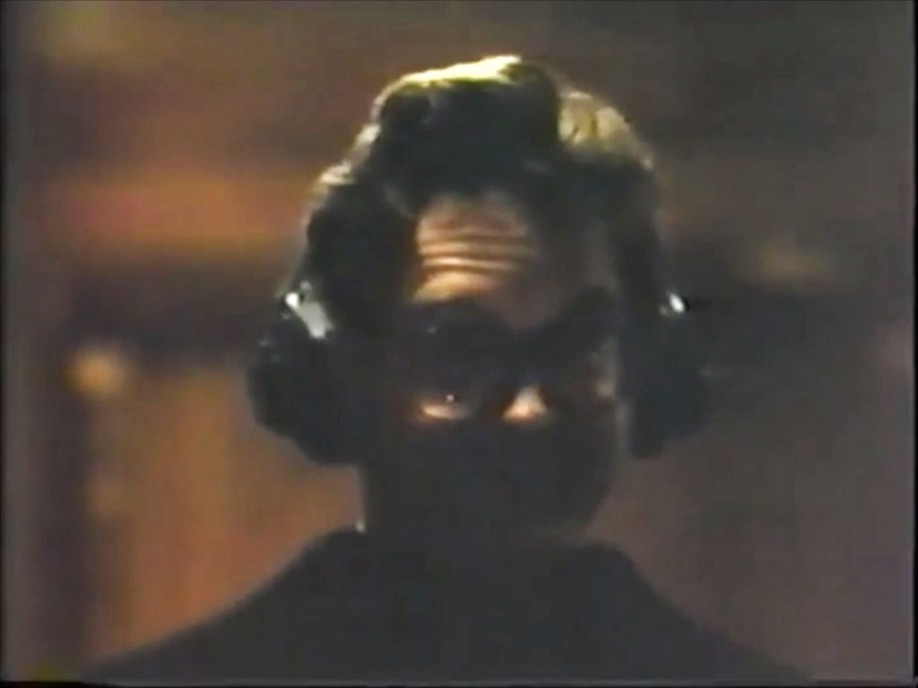 Mark Frost standing in a doorway wearing headphones