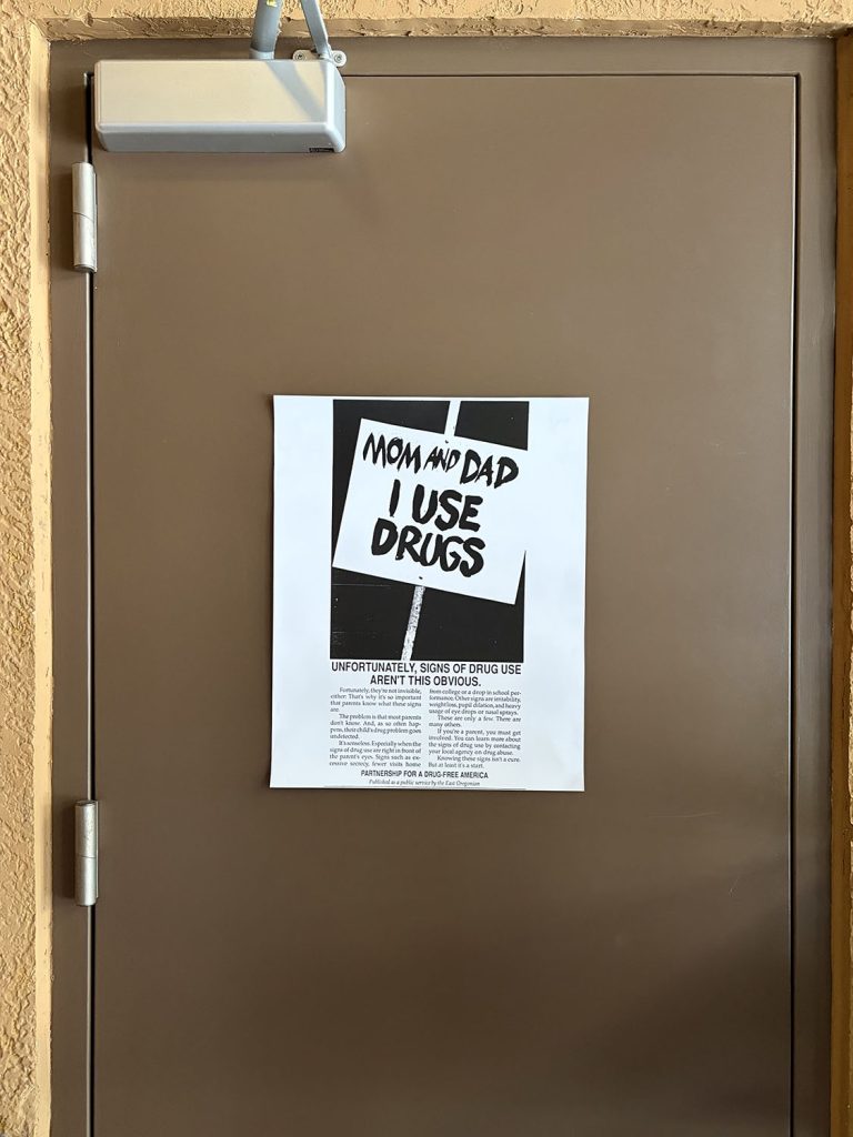 Mom and Dad - I Use Drugs sign on a door