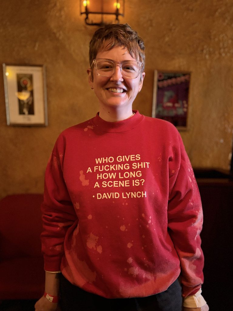 Person wearing a sweater with a David Lynch quote