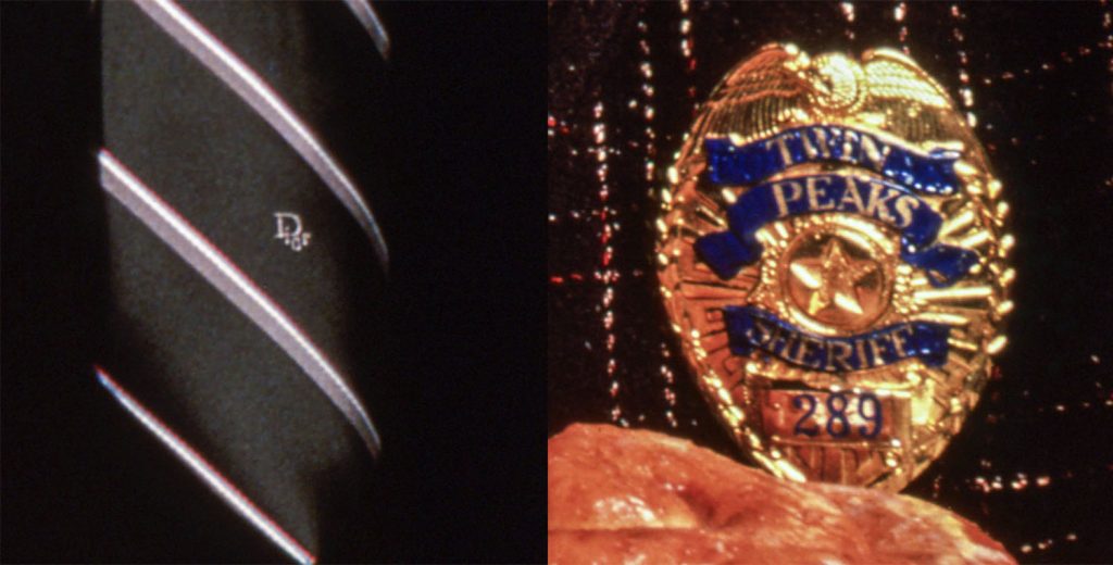 Close up of Agent Cooper's Dior tie and Sheriff Harry S. Truman's badge