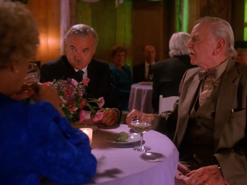 Mayor Milford and Pete Martell at a table
