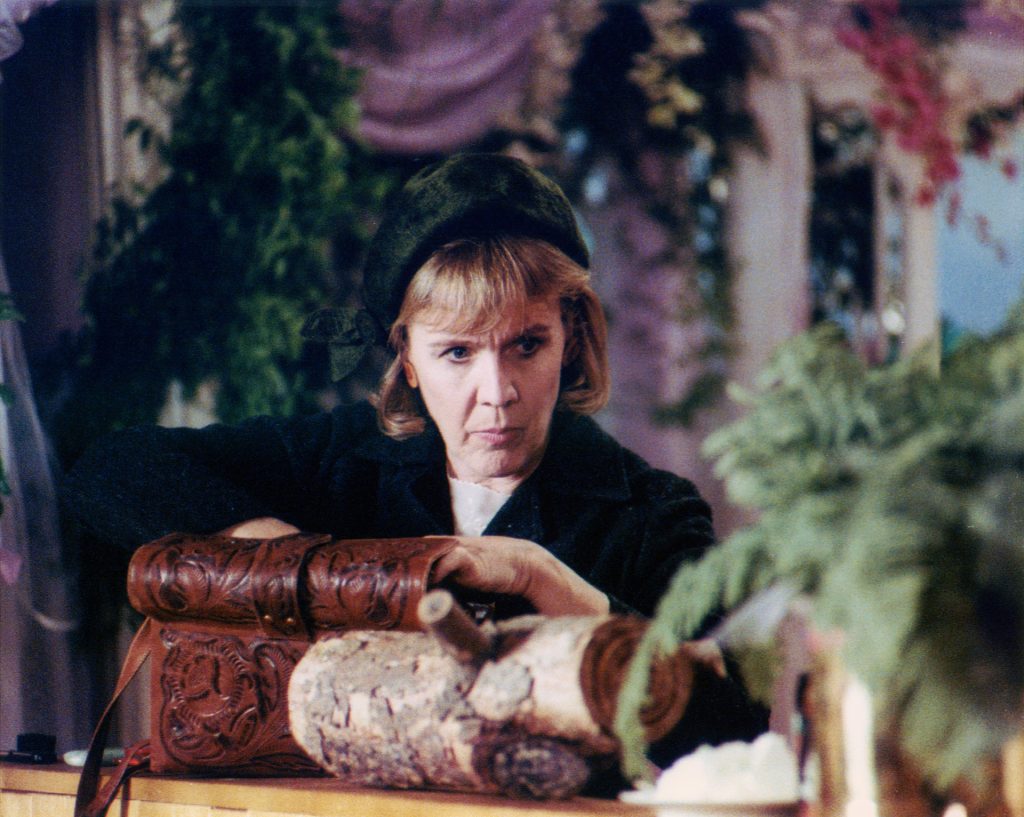 Log Lady checking her handbag