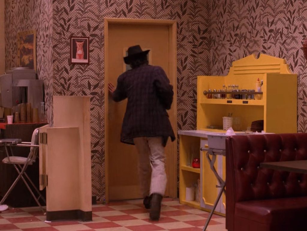 Sheriff Harry S. Truman heads to the bathroom at the Double R Diner