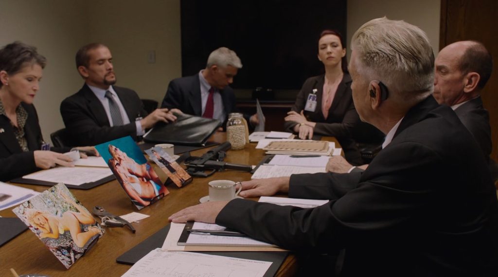 FBI Agents around a conference room table