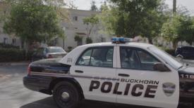 Buckhorn Police car parked outside an apartment building