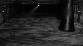 Black and white image of a room with flooring