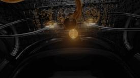 Golden machine hanging from the ceiling with a golden orb floating up