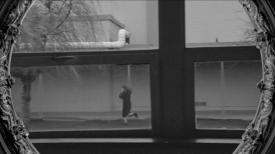 Person running in a school courtyard