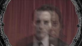Image of Dale Cooper and Mr. C on red drapes