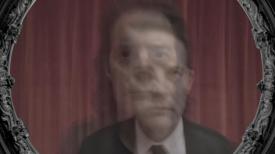 Image of Dale Cooper and Mr. C on red drapes