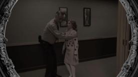 Two people in a hallway