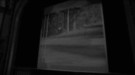 Movie screen with an empty parking lot