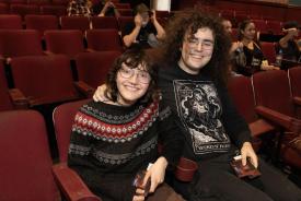 Two people in a theatre