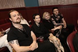 Four people in a theatre